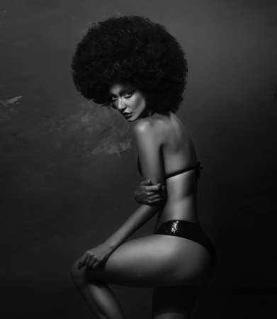 Girl in studio with an African hairstyleの写真素材