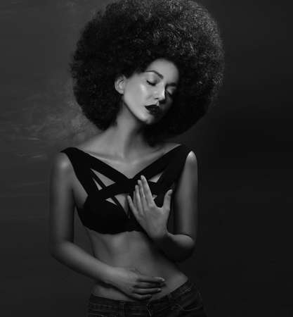Girl in studio with an African hairstyleの写真素材