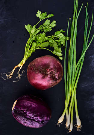 young onions, Red Cabbage, parsley beetroots, on blackboard backgroundの写真素材