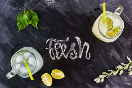 Lemonade on blackboard top view flat layout