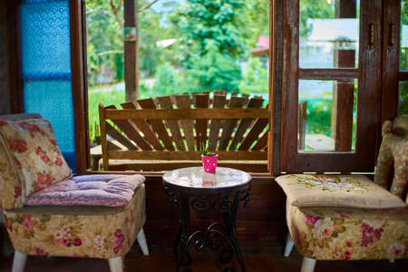 Old vintage cushions chairs and table cafe styleの写真素材