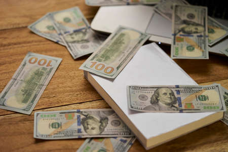 Book with money and Laptop flat layoutの写真素材