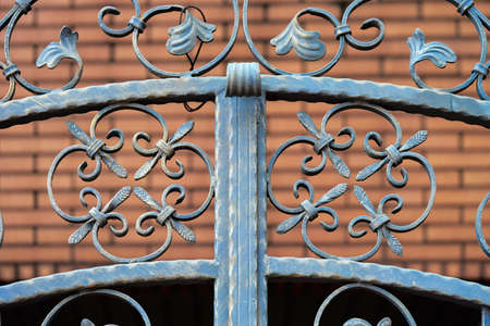Cast Iron Fence Red Bricks Background urbanの写真素材