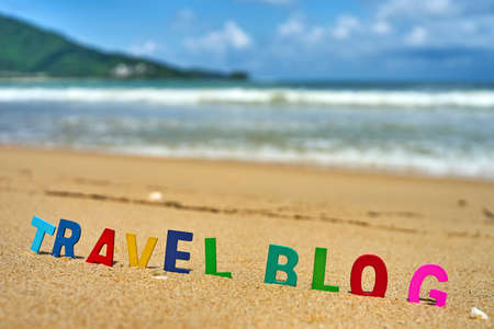 TRAVEL BLOG wood letters on the beachの写真素材