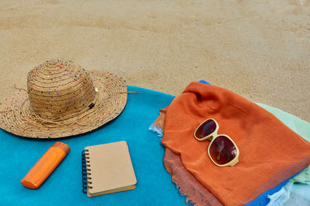 sandy beach with summer accessories travel blog contentの写真素材