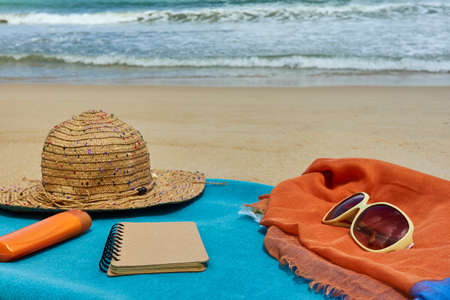 Top view of sandy beach with summer accessories travel blog contentの写真素材