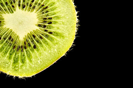 Beautiful slice of fresh juicy kiwi isolatedの写真素材