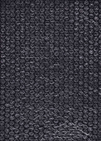 Bubble Wrap Packing on black background Or Air Cushion Film Abstract Horizontal Texture For Creative...