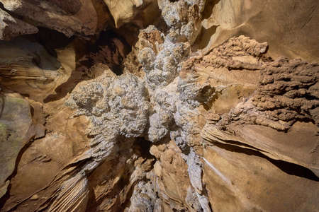 Beautiful illuminated cave formations and stalactitesの写真素材
