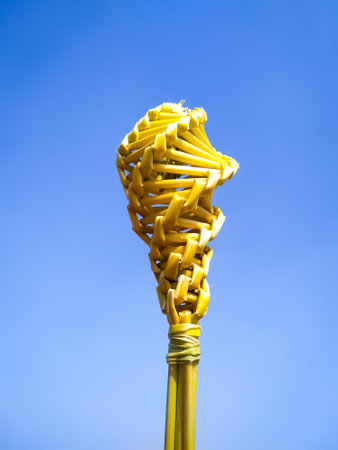 Golden colour wood stick on blue backgroundの写真素材