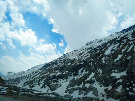 Selective focus clouds over the snow covered mountains