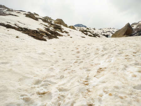 Selective focus view of beautiful snowy mountains and rocks coveringの写真素材