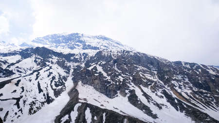 A summer mountain landscape with snowの写真素材