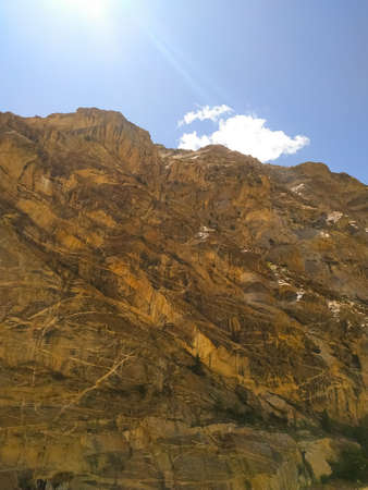 A mountain landscape with clouds