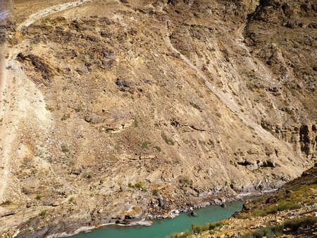 River in mountain landscape with sky and cloudsの写真素材