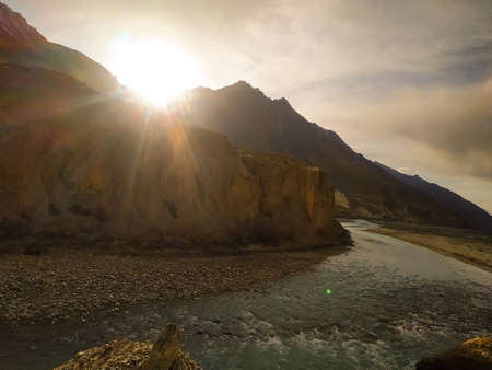 sunrise in the mountains with flowing riverの写真素材
