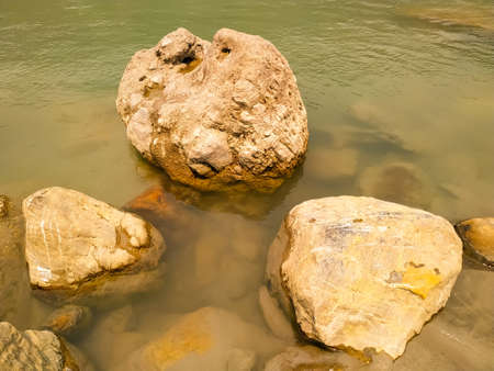 River stream of water flowing on stonesの写真素材