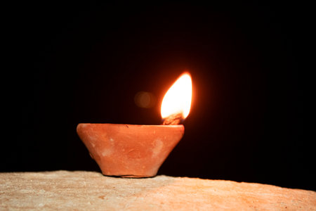 Diya light on black background. Diwali festival concept.の写真素材