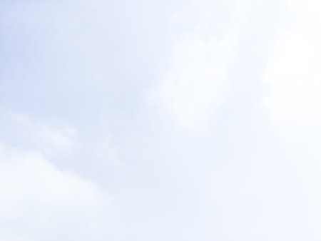 Blue sky background with tiny clouds, soft focus, and copy space. Blue sky background with white...