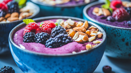 Blueberry smoothie bowl with fresh berries and nuts, selective focusの素材