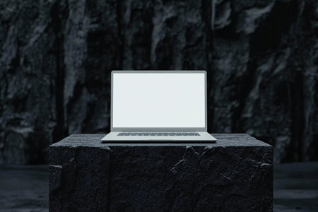 Laptop with blank screen on stone. 3d rendering. Computer digital drawing.の素材