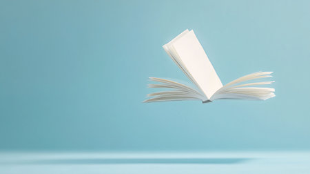 Open book on a blue background. Back to school. Copy space.の素材