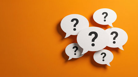 Question mark on speech bubbles on orange background. FAQ and support conceptの素材