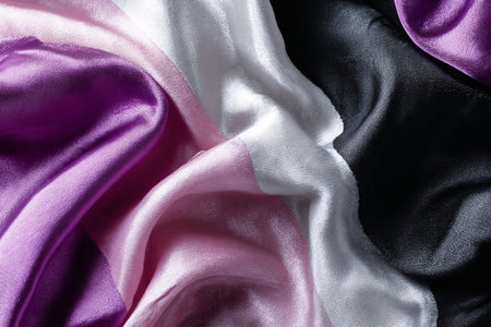 abstract background of satin fabric in pink and purple colors for designの素材