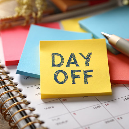 Day off reminder on the calendar with office supplies, closeup.の素材
