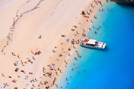 People standing in the sun at Navagio Zakynthos, Greece, near the famous shipwreckのeditorial素材