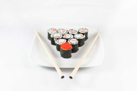 Sushi menu and chopsticks on plate, white backgroundの写真素材