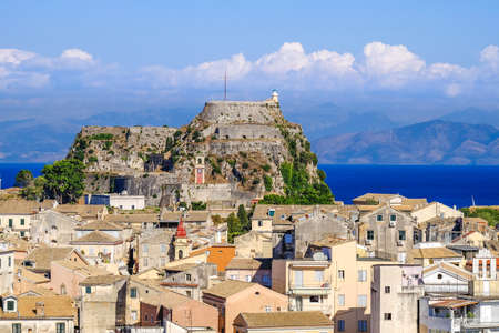 Corfu panorama over the old city. Venetian fortress in background and old clock tower, city symbol.