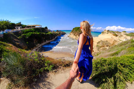 Couple holding hands at Canal D'Amour, Corfu island, Greeceの写真素材
