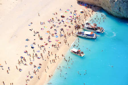 Tourists on the sand beach of Navagio Zakynthos Greece.の写真素材