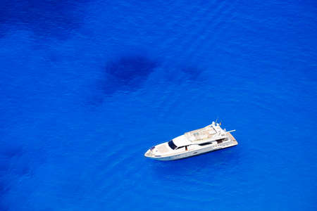 Yacht anchored at sea in Greece near Zakynthos Islandの写真素材