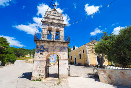 Old bell tower in traditional greek village on the island of Zakynthosの写真素材