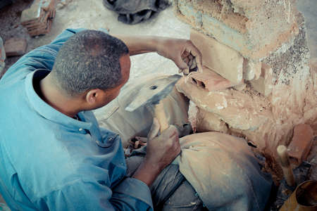 FEZ, MOROCCO, JUNE 2016: traditional pottery worker on the streets in the old Medinaのeditorial素材