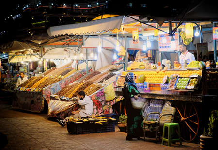 MARRAKECH, MOROCCO, JUNE 2016: woman shoping groceries in the old Jama el-Fna marketのeditorial素材
