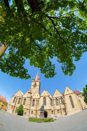 Sibiu, Transylvania, Romania. Old Catholic Cathedral in the main town square. Artistic interpretation.の写真素材