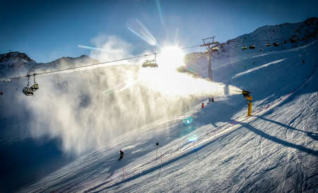 Skiing at sunset in Alpine ski resort . Artistic HDR image.の写真素材