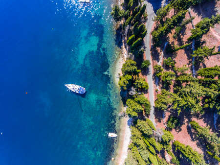 Luxury yacht docked near the cliff, on Corfu Island, Kerkyra, Greece.の写真素材