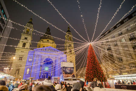 BUDAPEST, HUNGARY - 8 DECEMBER 2016: Tourists enjoy the Christmas market at Vorosmarty Platz in the city center in Budapest, Hungary, Europeのeditorial素材