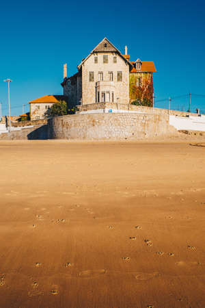 Empty beach in Cascais city near Lisbon, Portugal at sunrise