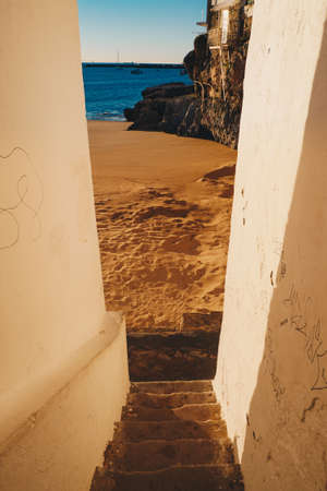 The sand beach in Cascais Portugal in the morning at sunriseの写真素材