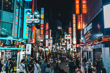 Tokyo, Japan, October 2017: Crowded Tokyo city street at night in Shibuya districtのeditorial素材