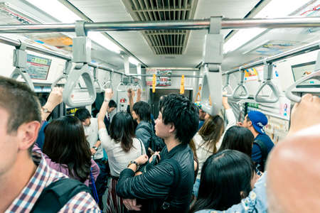 Tokyo, Japan, October 2017: People riding the  subway train in Tokyo City, Japanのeditorial素材