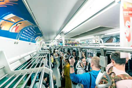 Tokyo, Japan, October 2017: People on subway train in Tokyo City, Japanのeditorial素材