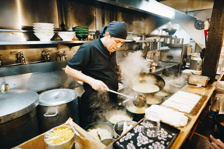 Tokyo, Japan, October 2017: Traditional street-food restaurant in Tokyo with noodles and Ramen food servingのeditorial素材