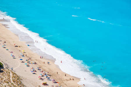 Tourists on Milos Beach in Lefkada Greeceの写真素材