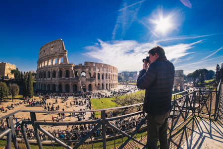 Tourist taking pictures at the Colosseum in Rome, Italyのeditorial素材